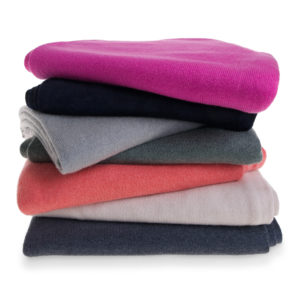 stack of cashmere clothing for Fig Cashmere